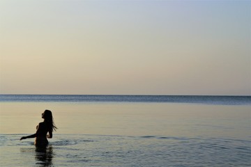 Canvas Print - 
girl at sea at sunrise