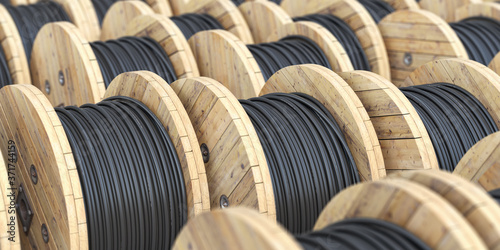 Fotografía Warehouse with wooden coil wire electric cable.