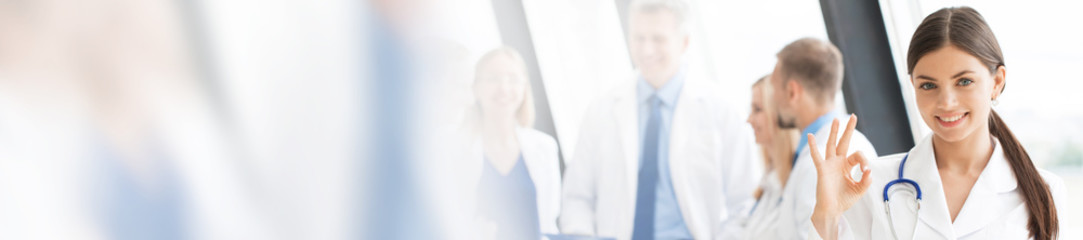 Wall Mural - Female doctor showing Ok sign