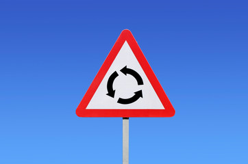 roundabout ahead warning sign