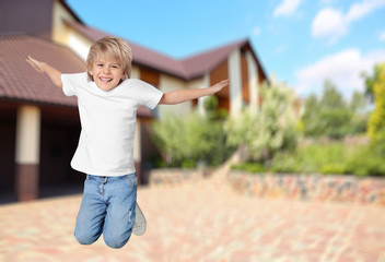 Sticker - Happy boy jumping near house, space for text. School holidays