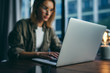 © Rymden - Young woman working with a laptop. Female freelancer connecting to internet via computer. Businesswoman at work