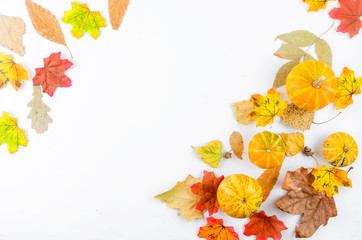 Wall Mural - autumn background with yellow leaves and pumpkin