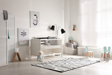 Wall Mural - Cute baby room interior with crib and decor elements