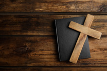 Christian Cross And Bible On Wooden Background, Top View With Space For Text. Religion Concept