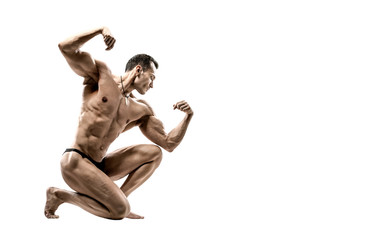 Wall Mural - man - bodybuilder pose on white background