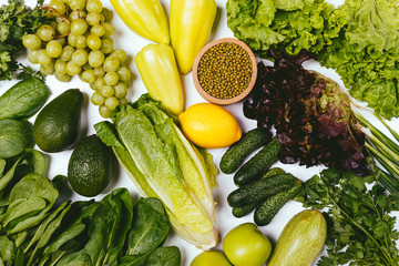 Wall Mural - Organic green vegetables, herbs, fruits and mung beans on white background