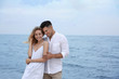 © New Africa - Happy couple on beach, space for text. Romantic walk