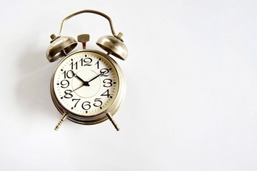 Alarm clock on a light background close-up. The concept of getting up in the morning and being late