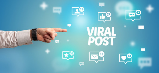 close-up of cropped hand pointing at viral post inscription, social networking concept
