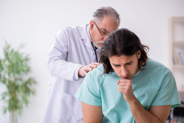 Young male patient visiting experienced doctor