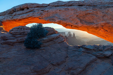 Wall Mural - mesa arch light at sunrise with washerwoman in the background canyonlands national park utah usa