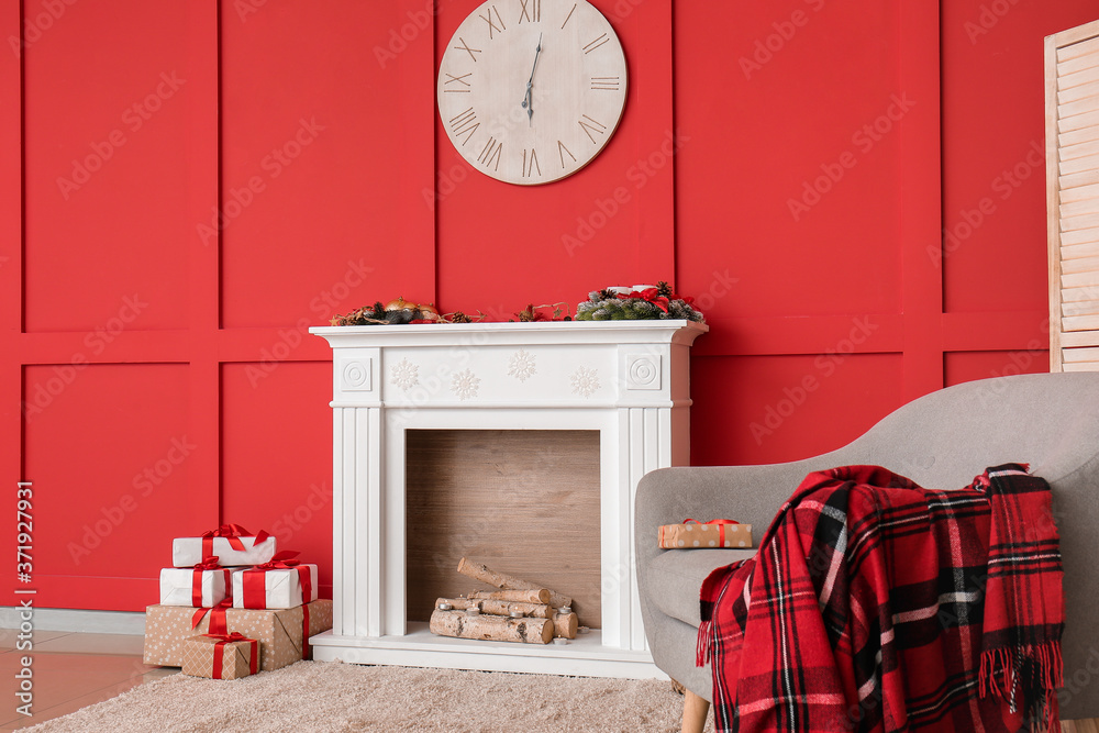 Interior of modern room with fireplace on Christmas eve