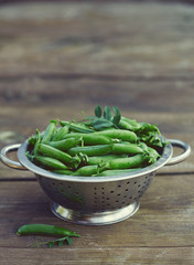 Sticker - fresh green peas on wooden surface