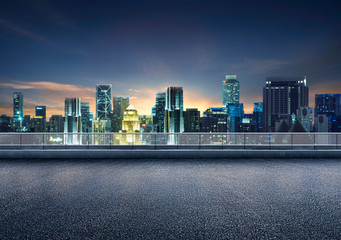 Wall Mural - Empty floor platform with night view city skyline background