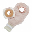 Two piece ostomy appliance including flange and pouch isolated a a white background