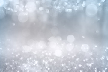 Aufkleber - Bokeh effects on silver glittering background
White bokeh effects on blue and silver glittering abstract background with rays of light. Background for wedding and christmas. Space for design and text.