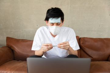 Young man Video chatting With his Doctor at home.