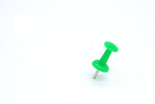 Green Pins On White Background.