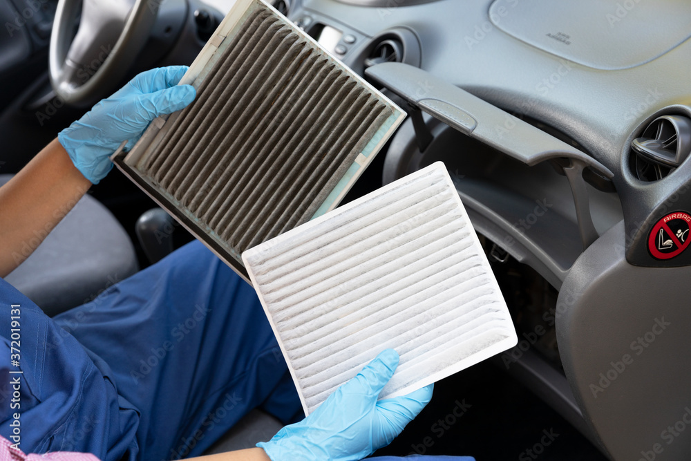 Replacement of cabin pollen air filter for a car - obrazy, fototapety, plakaty 