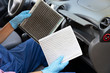 © wellphoto - Replacement of cabin pollen air filter for a car