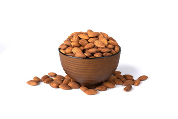 Almonds in wooden bowl isolated on white background