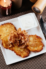 Wall Mural - potato pancakes with fried chicken