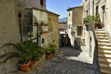 A narrow street among the old houses of Altomonte, a rural village in the Calabria region.