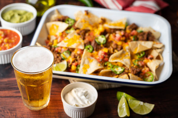 Wall Mural - nachos with beer, party food