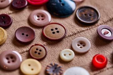 Poster - Background and texture of multicolored antique buttons and sewing tools