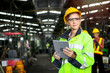 © Stella - Young beautiful woman industrial engineer worker wearing safely helmet and protective clothing holding digital tablet for operating machinery at manufacturing plant factory, work industry job concept