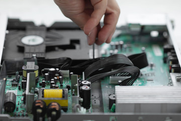 Poster - Hands with tools for repair computer. Blurred background.