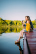 © Georgii - Cool mother and baby boy sitting on dock launch soap bubbles. Summer photography for blog or ad about family and travel