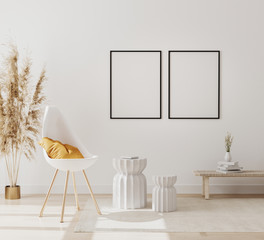 Wall Mural - blank poster frames mockup in modern interior background with empty white wall, chair and pampas gra