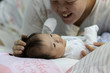 © alenthien - Portraiture image of Asian Cute little baby boy lying on bed