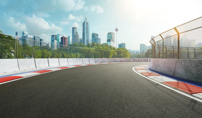 Wall Mural - Racetrack with railing and city background, daytime scene. 3d rendering