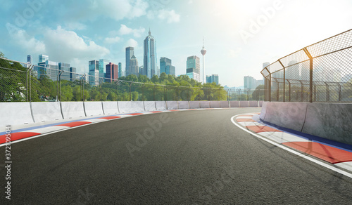 Fototapeta na szkło Racetrack with railing and city background, daytime scene. 3d rendering