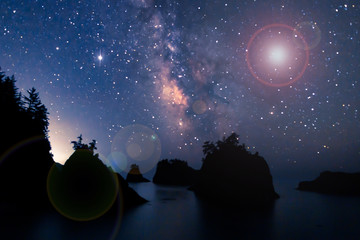 Wall Mural - starry night sky and milky way over sea stack island on the oregon coast