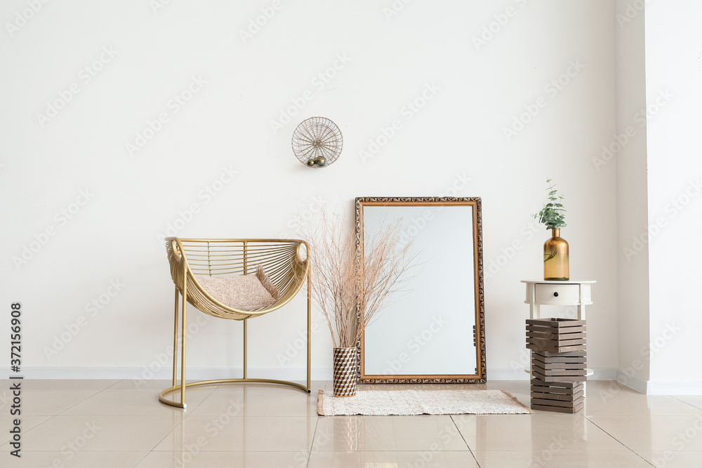 Stylish interior of modern living room with mirror and armchair - obrazy, fototapety, plakaty 