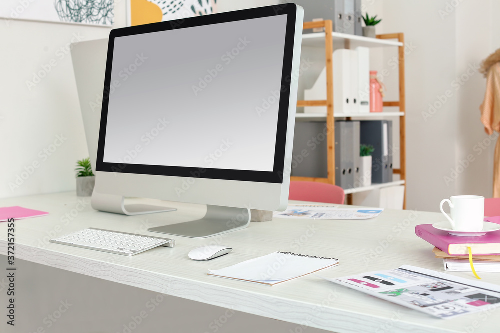 Comfortable workplace in modern office with computer