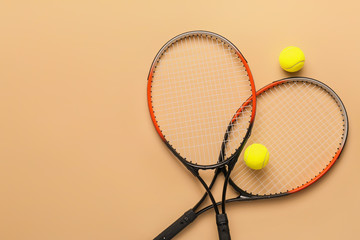 Poster - Tennis rackets with balls on color background
