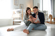© New Africa - Happy couple with their newborn baby at home