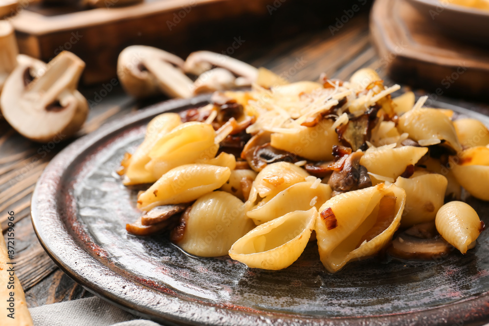 Plate with tasty conchiglie pasta, closeup