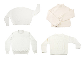 Set of stylish sweaters on white background