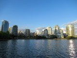 Fototapeta Miasta - Sea and apartment buildings in Vancouver at summer.