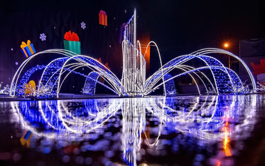 Wall Mural - Fountain decorated with lights of different color