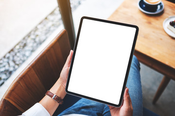 Top view mockup image of a business woman holding digital tablet with blank white desktop screen