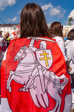 Vitebsk, Belarus - August 16, 2020 : A Girl With National Flag Of The State Of Belarus , The Rally In Belarus.