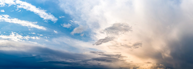 Wall Mural - Evening sky with gathering storm clouds as a background
