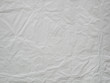 © amonphan - crumpled white paper background